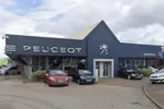 Front of a Peugeot dealership