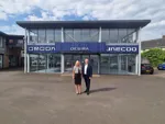 Directors Michelle Gant and Stuart Stone with the new signage at Desira OMODA & JAECOO Norwich