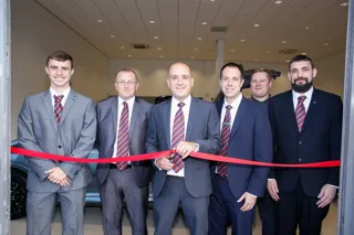 Chad Ridley sales manager at Vertu Honda Morpeth with staff cuts the ribbon to officially open the new dealership