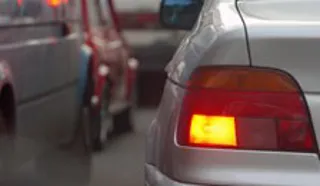 car indicates to change lanes in heavy traffic