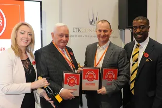 Swansway chairman Michael Smyth (centre left) and group director John Smyth (centre  right) accept their AM Best UK Dealerships to Work For awards from LTK Consultants’  managing director, Andrew Landell, and operations director Vanessa Kendrick