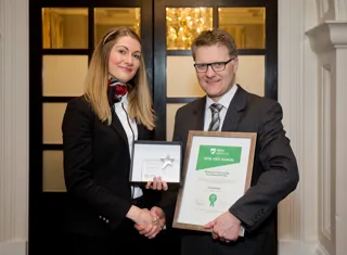 Accountant Malwina Bartosiak receives her award from Vertu Motors chief executive Robert Forrester