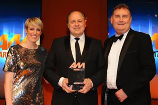 AM Awards host, Stepg McGovern, left, Philip J Deacon, centre, head of marketing, Marshall Motor Group, collects the award for Digital Initiative of the Year from Darren Moon, sales director, Auto Trader, right. 