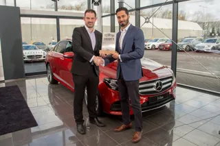 Class: Mercedes-Benz's Krishan Bodhani receives the E-Class' Car of the Year accolade from John Challen