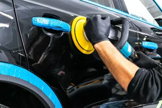 Car being polished by machine