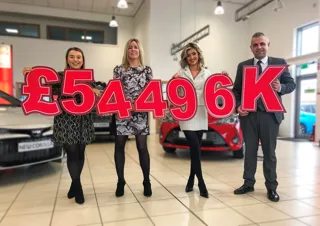 Pictured announcing the fundraising total for Charles Hurst Toyota (L-R) Lauren Hyndman (brand marketing manager at Charles Hurst Toyota), Lucy McCusker (Action Cancer), Zara Dunlop (sales executive at Charles Hurst Toyota) and Ross Graham (franchise sales manager at Charles Hurst Toyota)
