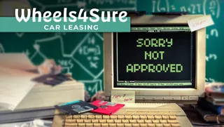 Wheels4Sure logo with old computer showing 'sorry not approved' message