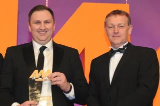 Darren Cuthbertson, franchise  director, Peter Vardy CarStore Glasgow, collects the award from Keith Bell, national accounts director, Barclays Partner Finance, right