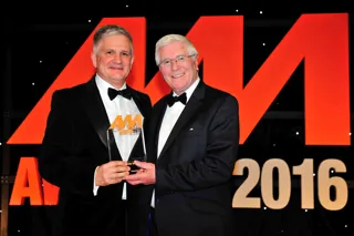 Gary Savage, chief executive, Mercedes-Benz UK (left), accepts the award on behalf of City West Country from John Boseley, managing director, Diamondbrite Automotive