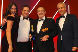 Gordon Veale, general manager, Carbase, (second from right) and Alex Jones, marketing manager (second from left) collects the award from Robert Hutchinson, sales director Motor Finance, BNP Paribas Personal Finance, right and host Lisa Snowdon left