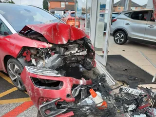 Damaged car that collided into Sandicliffe MG showroom