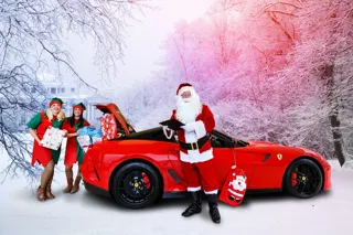 Feeling festive: JCT600 colleagues Kirsty Temple, Nicola Waugh and Gary Wilkinson with a Ferrari 599 GTO