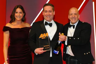 John Keogh, sales director, Rygor Commercials, collects the award from Alex Watt, regional sales  director, Barclays Partner Finance, right, and host Lisa Snowdon, left