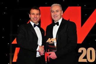 John Vilums, general manager, Perrys Vauxhall Doncaster (right), accepts his award from Stephen Briers, editor-in-chief, AM