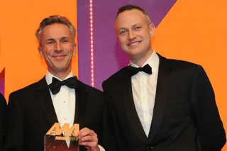 Jon Wakefield, managing  director, Volvo Car UK, collects the award from Andrew Hooks, chief operating officer, carwow, right
