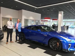 Kevin Abbs collects his Nissan GT-R from Jass Singh, GT-R specialist at Lookers Nissan Leeds