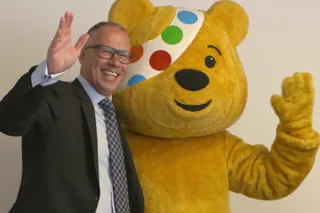 Lookers managing director, Allan Rushforth, welcomes Pudsey Bear