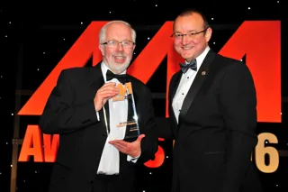 Reg Tutt, managing director, Sandicliffe (left), accepts the award for Most Improved Dealership from Neil Pursell, managing director, Martec Europe
