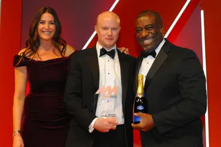 Richard Gough, general manager, Mercedes-Benz of Preston, accepts the award from Andrew Landell, managing director, LTK Consultants, right, and Lisa Snowdon, left