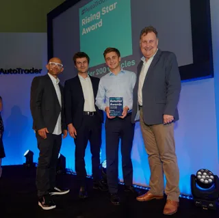 Jacob Freshwater (holding award) collects his Auto Trader Retail Awards Rising Star accolade alongside his brother Isaac last month