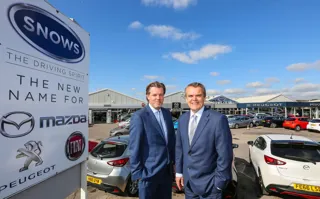 Snows Group board director Neil McCue (left), with group chairman Stephen Snow, outside its new multi-brand site in Portsmouth