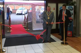 Burton-on-Trent mayor, Simon Gaskin, cuts the ribbon at T L Darby's new MG Motors UK showroom