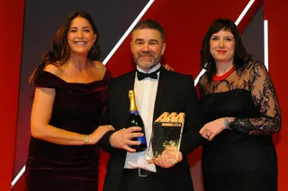 Tony Hodgson, aftersales manager,  J Edgar & Son, accepts the award from  Amy Davis, head of marketing, Gtechniq, right, and host Lisa Snowdon, left