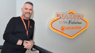 Vanarama CEO Andy Alderson at the online leasing brokerage's welcome sign