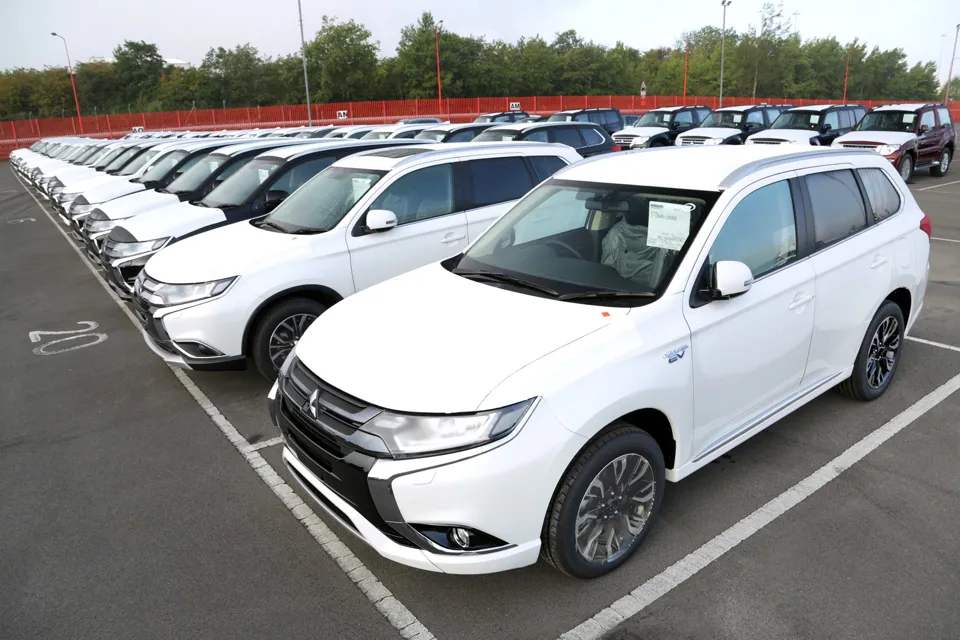 Facelifted Mitsubishi Outlander PHEVs parked in rows 