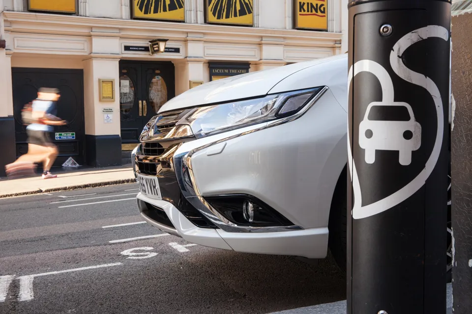 Mitsubishi Outlander PHEV 2015 in London street by charging point