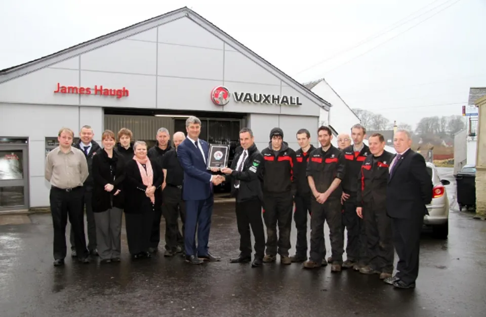 Jim Haugh, managing director of James Haugh (Castle Douglas) receives the Vauxhall award from Peter Hope, Vauxhall customer experience director for Vauxhall Motors UK and Ireland in 2015