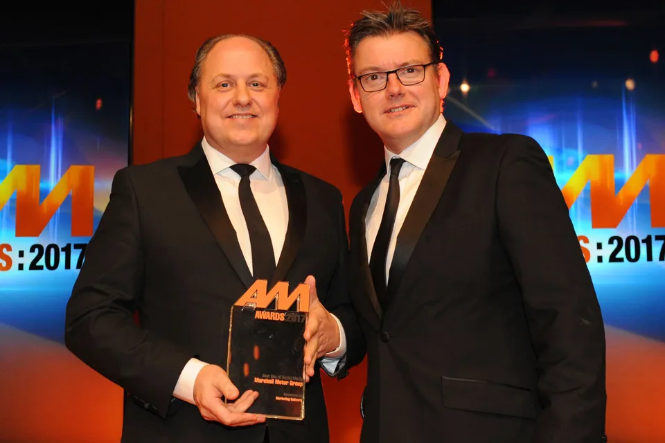 Philip J Deacon, head of  marketing, Marshall Motor Group, accepts the AM Award 2017: Best use of social media from Jeremy Evans, managing director, Marketing Delivery