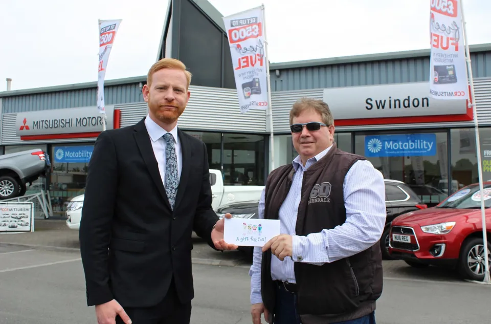CCR's Andy Jackman presents shopper Gary Broom with his prize