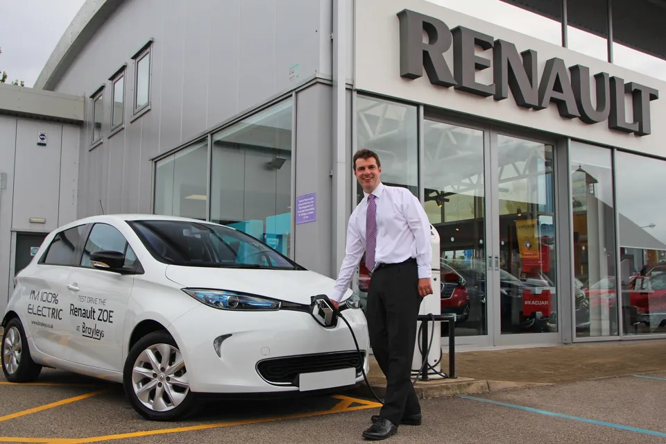 Richard Lodge, general manager of Brayley Renault Milton Keynes, charges a Renault ZOE EV