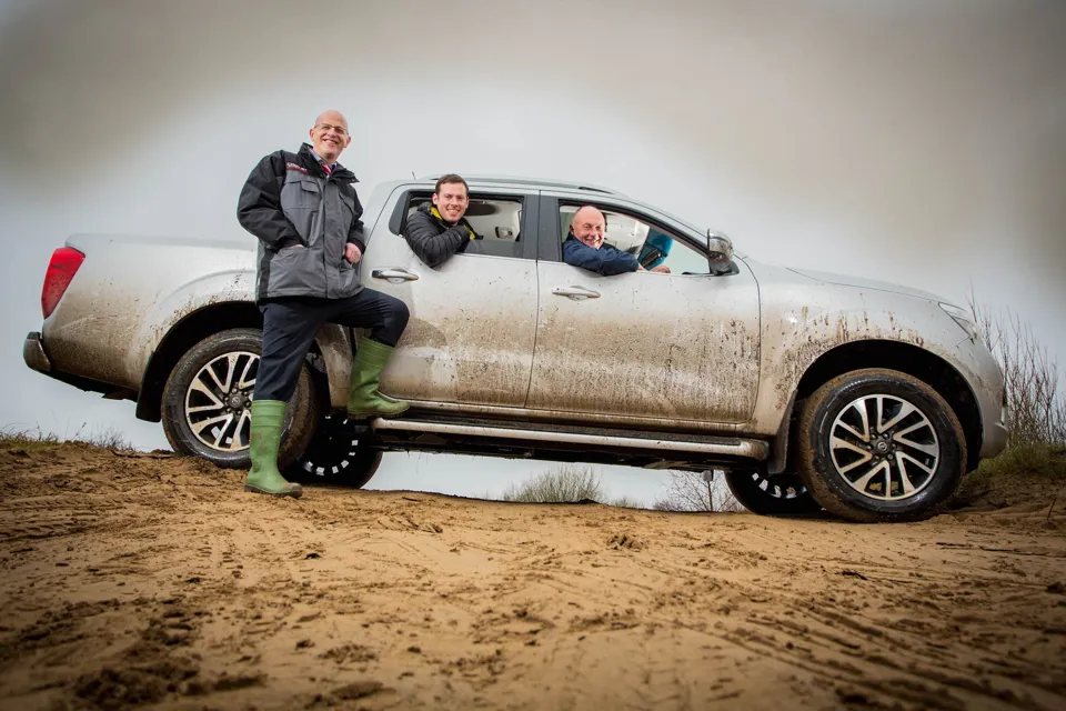 Off-road (left to right): Chorley Group sales manager Alex Cullen shows off the new Navara to Mark Lockley and his son Matthew
