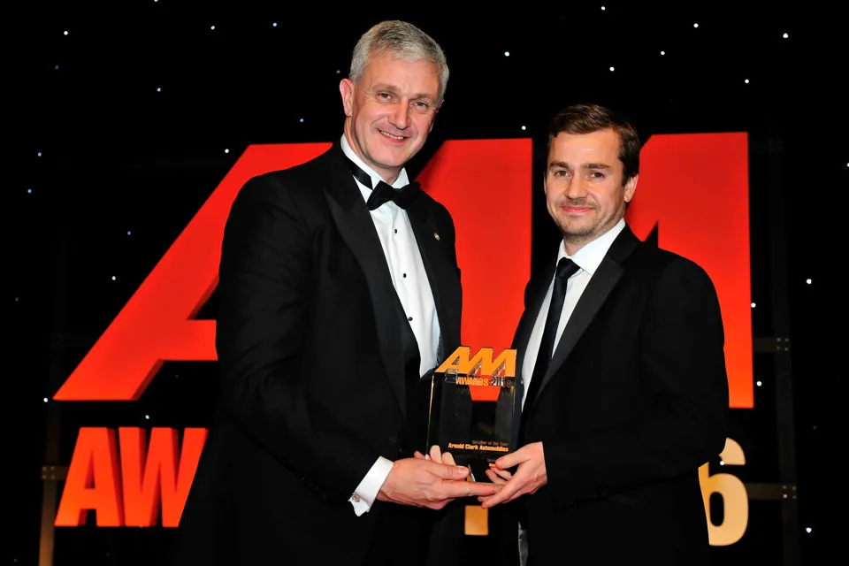 Eddie Hawthorne, group managing director, Arnold Clark Automobiles (left), accepts the Retailer of the Year award from Richard Jones, managing director, Black Horse