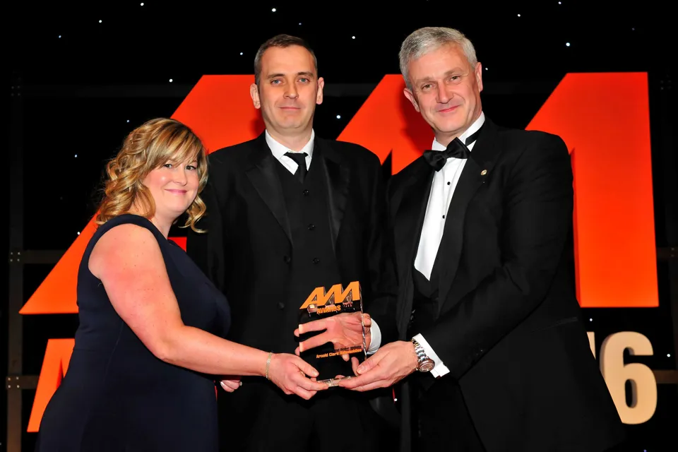 Arnold Clark Automobiles managing director Eddie Hawthorne, right, and Carol  Fairchild, group marketing and product development manager, left, collect their award