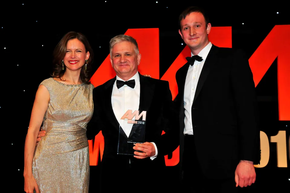 Gary Savage, CEO, Mercedes-Benz UK, accepts his award from host Katie Derham, and Simon Webb, head of sales and development, Premia Solutions (right)