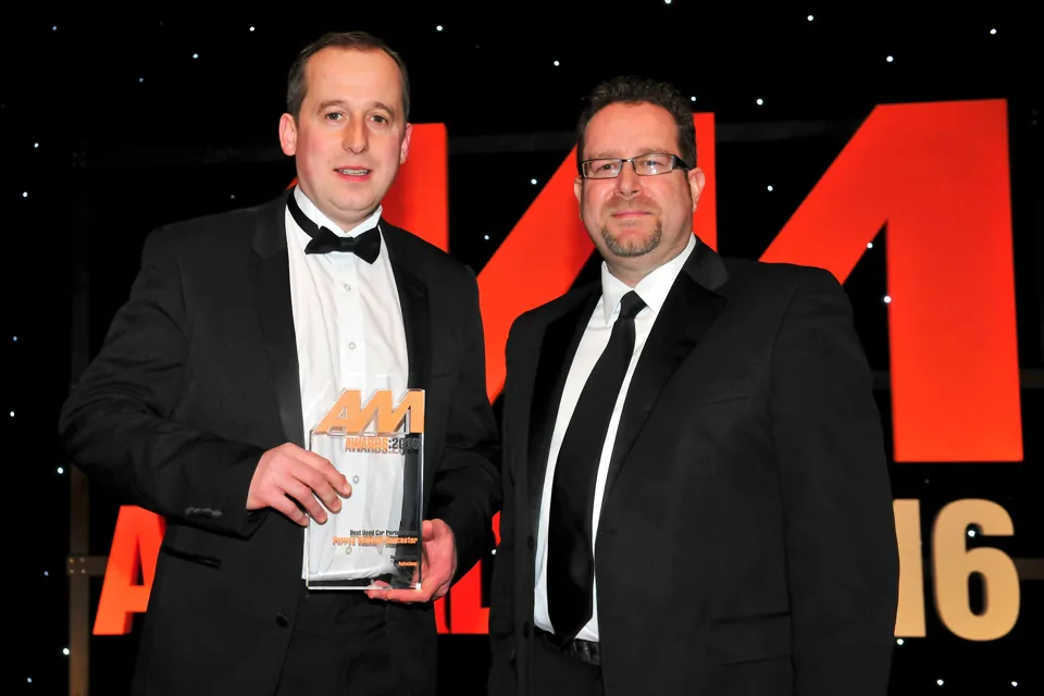 John Greenwood, sales manager, Perrys Vauxhall Doncaster (left), accepts the award for Best Used Car Performance from Martin Peters, sales director, Autoclenz