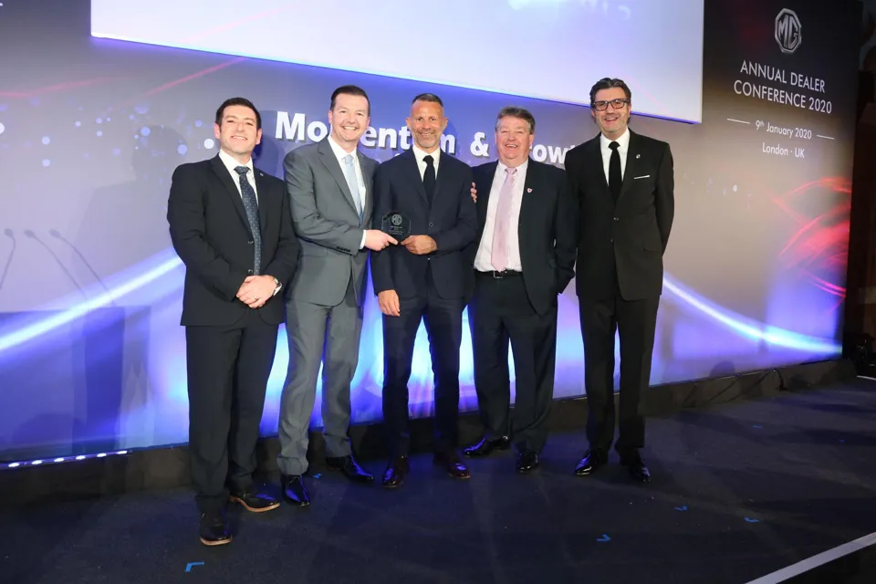 Nathaniel Cars receives its MG Motor UK Dealer of the Year Award 2019 from Wales football coach Ryan Giggs and Daniel Gregorious, MG Motor UK’s head of sales and marketing (left)