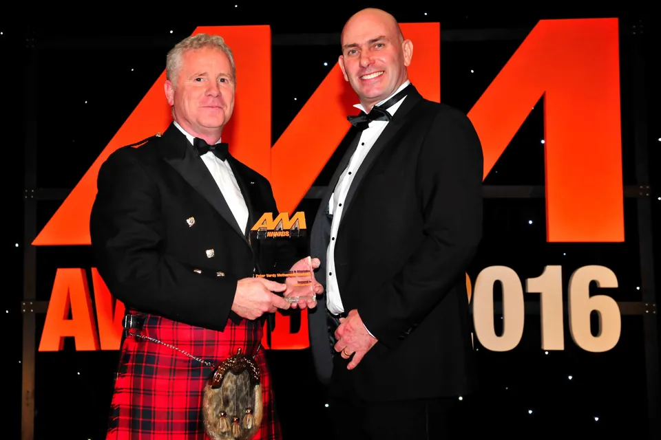 Scott Reid, managing partner at Peter Vardy Motherwell Vauxhall (left), collects his award from Rob East, sales manager, automotive division at FUCHS Lubricants