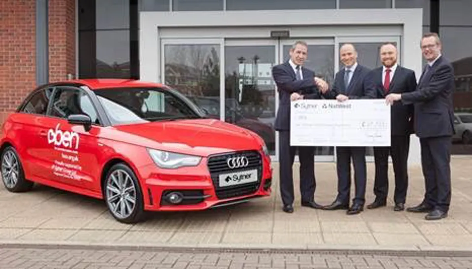 Sytner Group representatives present charity donation of £27,721 to BEN's Gary Cully (left)